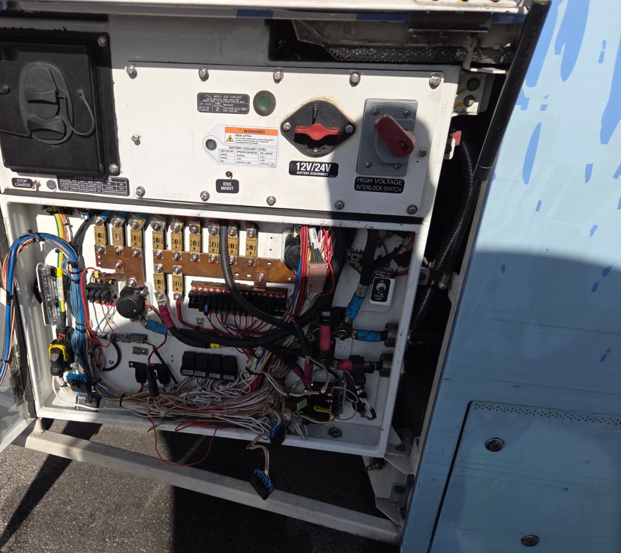 Open 12V/24V and high voltage panel on the bus