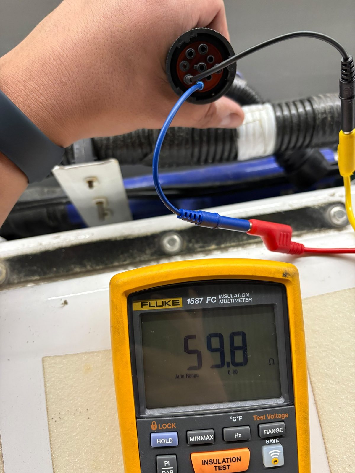 Multimeter reading 59.8 ohms between CAN high and CAN low at a 9 pin diagnostic connector